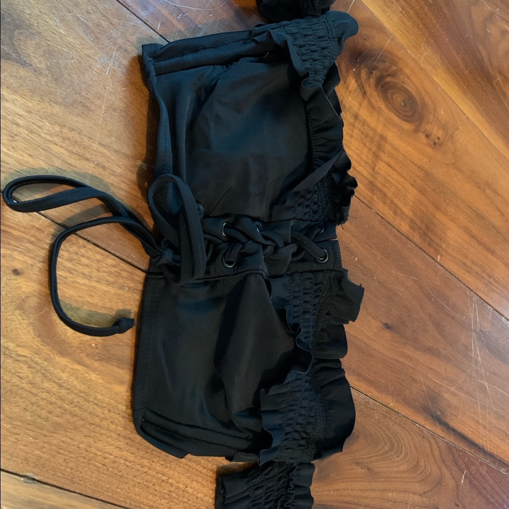 Strapless black swim top